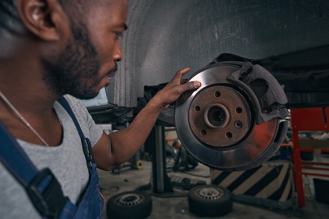 person repairing the brake system